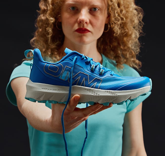 Model Holding up Shoe 3 Female
